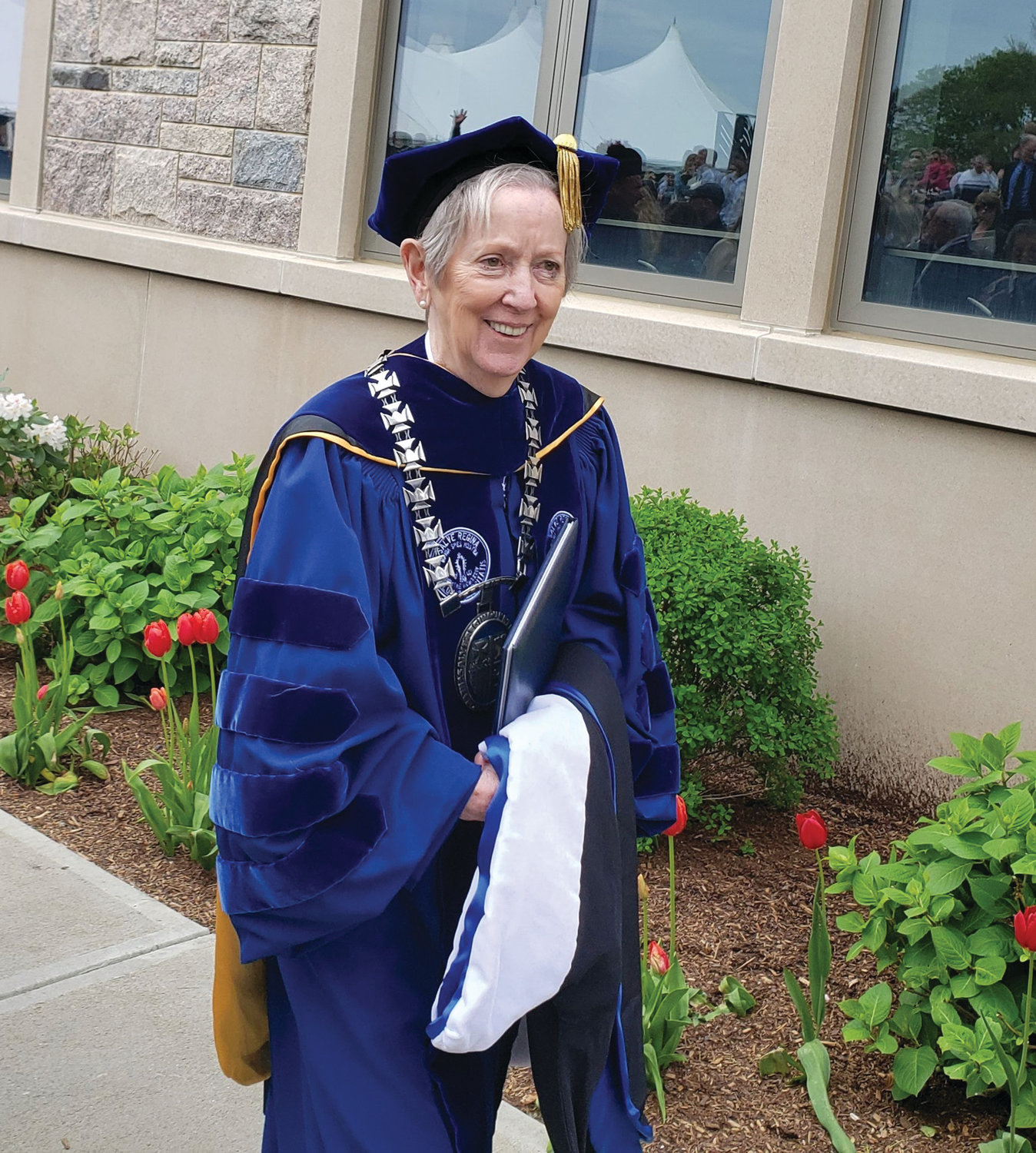 Salve Regina University President Sister Jane Gerety leads the procession, right, following the university’s 69th commencement ceremony on May 19, in which 505 graduates received bachelor’s degrees. Sister Gerety, who will be retiring in June after 10 years of leading the university, was the event’s keynote speaker.
